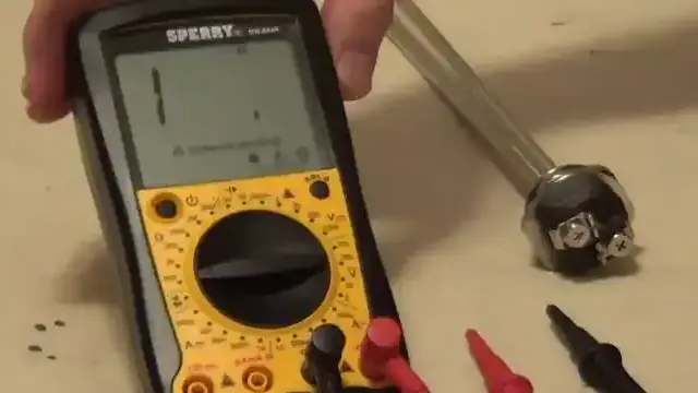 Multimeter testing a water heater element