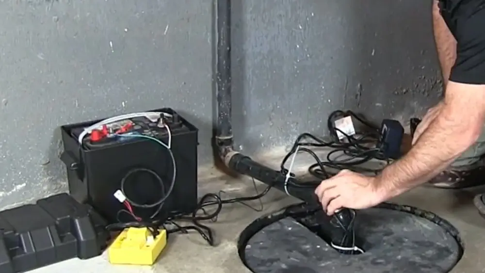 Battery backup and pump beside a sump pit